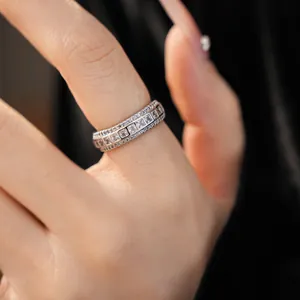 Close-up detail of a silver-toned band ring set with sparkling cubic zirconia stones.