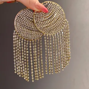 Close-up of sparkling rhinestone circular tassel hoop earrings with elegant fringe detail