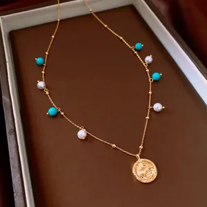 Elegant 18K gold plated necklace with white pearls, turquoise beads and coin pendant