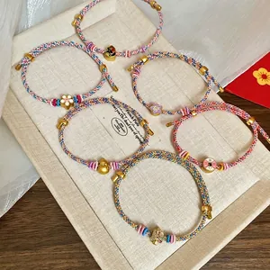 Hand-woven colorful cord bracelets with floral and gourd charms for Dragon Boat Festival