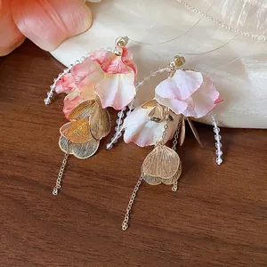 Elegant floral drop earrings with pink gradient petals, gold leaf accents and pearl beads