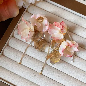 Elegant Korean-style stud earrings with pink acrylic petals and gold leaf chain dangles