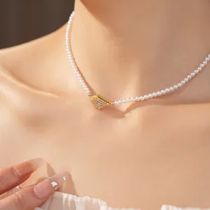 Elegant 18K gold plated pearl choker necklace with a sparkling zircon geometric pendant