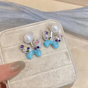 Elegant butterfly stud earrings with colorful zircon crystals and white pearls for women