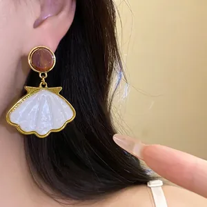 French vintage shell pendant earrings with resin top and gold-tone frame