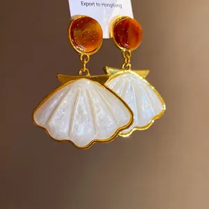 Elegant French vintage gold shell drop earrings with amber resin studs for women