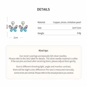 Detailed info for butterfly zircon earrings with 925 silver needles and pearl detail.