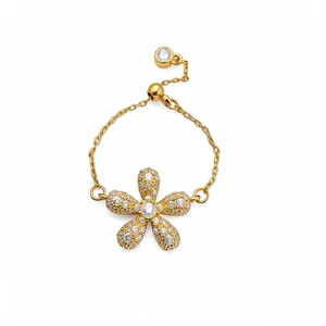 Exquisite gold-plated flower chain ring featuring pavé-set crystals and an adjustable band.