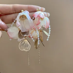 Elegant handmade fabric petal earrings with gold leaf charms and delicate dangling chains