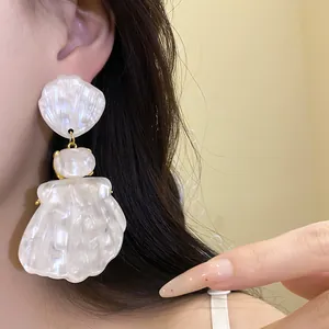 Detailed view of elegant vintage French style pearlescent resin shell drop earrings