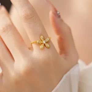 Sparkling gold five-petal flower ring with full pavé crystals and dainty chain band