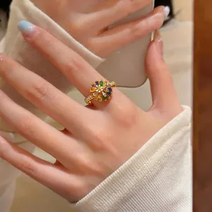 Exquisite 18k gold plated open ring featuring a colorful zircon sunflower design on hand