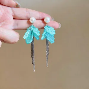 Elegant turquoise petal drop earrings with white pearls and long silver chain tassels