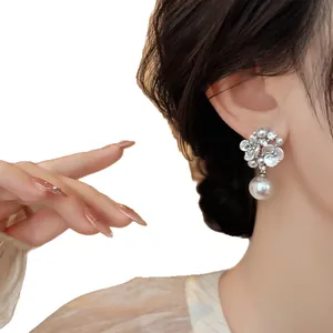 Elegant floral zircon pearl drop earrings for women in a stylish silver finish.