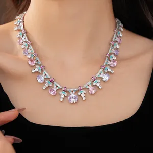 Close-up detail of palace style necklace with pink oval zircons and turquoise enamel finish