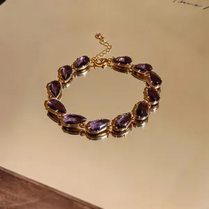 Detailed view of elegant purple water drop zircon bracelet with gold-plated finish