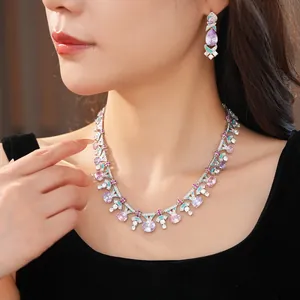 Close-up of elegant palace style jewelry set with purple stones and enamel detailing