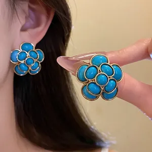 Vintage resin flower earring and ring set with turquoise blue petals and gold trim