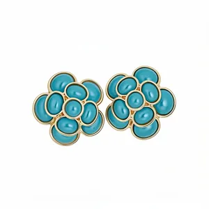 Elegant vintage style flower stud earrings with turquoise resin petals and gold finish