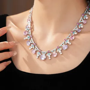 Detailed macro shot of vintage palace necklace with vibrant pink and purple zircon stones