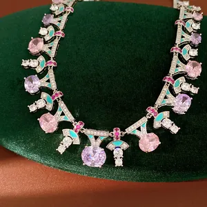 Macro detail of palace style vintage necklace with colorful dripping oil and inlaid sparkling zircons