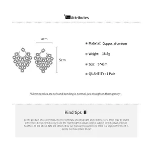 Detailed view of hollow copper and zirconium earrings showing 5x4cm size and 18.5g weight
