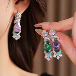Vintage palace style teardrop earrings featuring colorful enamel and cubic zirconia stones