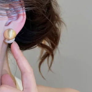 Elegant brushed gold round stud earrings with pearl back for stylish two-way wear
