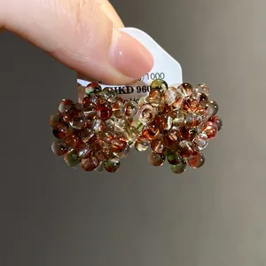 Close-up detail of exquisite multi-colored glass beaded cluster flower earrings for women