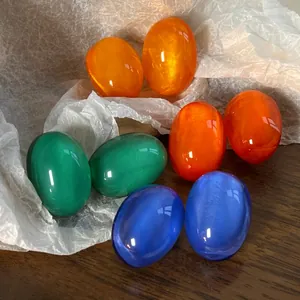 Detailed view of colorful oval cabochon earrings in French vintage dopamine style fashion