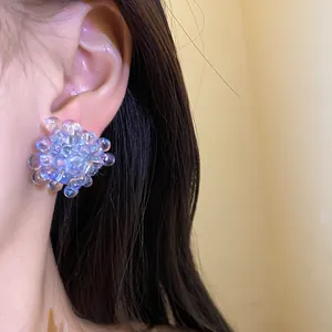Exquisite deep sea blue bubble cluster stud earrings with silver needles shown on ear