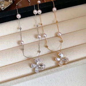 Elegant 18k gold plated flower necklace with zircon petals and delicate pearls