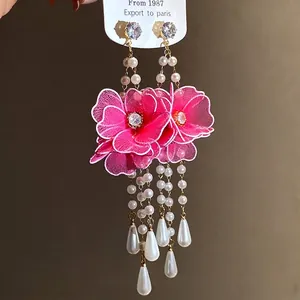 Elegant pink silk mesh flower earrings featuring pearl tassels and a silver needle hook.