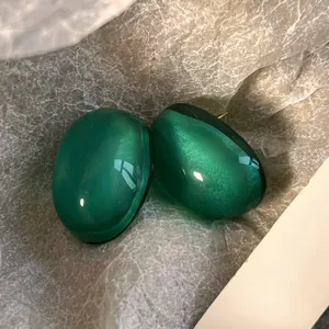 Detailed view of French vintage emerald green jelly bubble effect resin stud earrings