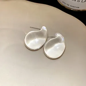 Macro view showing the transparent texture of teardrop acrylic stud earrings
