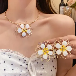 Elegant white enamel hollow flower necklace and earring jewelry set for women fashion