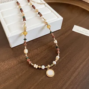 Handmade 18K gold plated beaded necklace with natural stones and a round pearl pendant charm