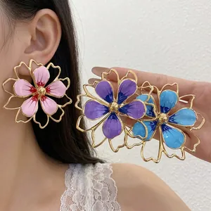 Oversized colorful enamel hollowed-out flower earrings with an elegant gold-tone finish