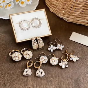 Elegant 18k gold plated flower stud earrings set with zircon and cat eye stones jewelry
