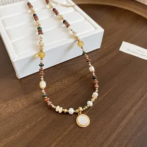 Close-up of Bohemian 18K gold plated beaded necklace featuring a round pearl pendant.