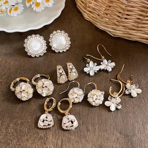 Elegant 18k gold plated flower ball earrings set with pearls and zirconia gems