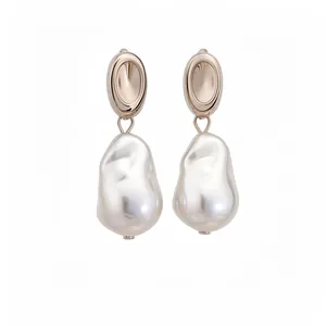 Elegant French retro baroque pearl drop earrings for women against a white background