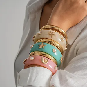 Set of 4 colorful resin bangles with gold starfish and pearl accents for resort style