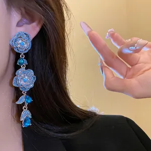 Vintage style silver needle blue floral tassel earrings with sparkling blue zircons