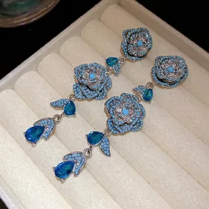 Elegant vintage-style flower tassel earrings with blue zircon stones in a gift box