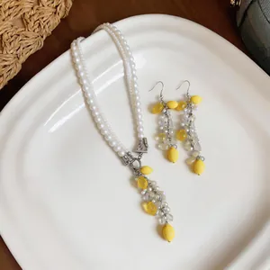 Pearl crystal necklace and earring set with yellow resin lemon charms for beach vacation
