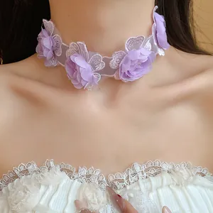 Close-up of a romantic purple floral lace choker necklace worn by a female model