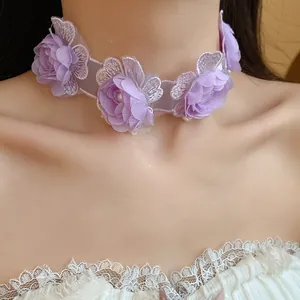 Close-up of a purple floral choker necklace with delicate lace and small pearl details