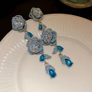 Vintage silver pin flower tassel earrings with sparkling blue zircon stones details