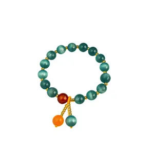Bracciale vintage di perle in occhio di gatto color verde acqua con dettagli d'oro